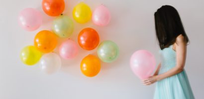 woman-holding-balloons