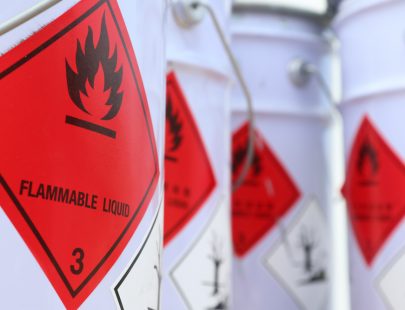 containers-of-flammable-liquid-with-warning-signs