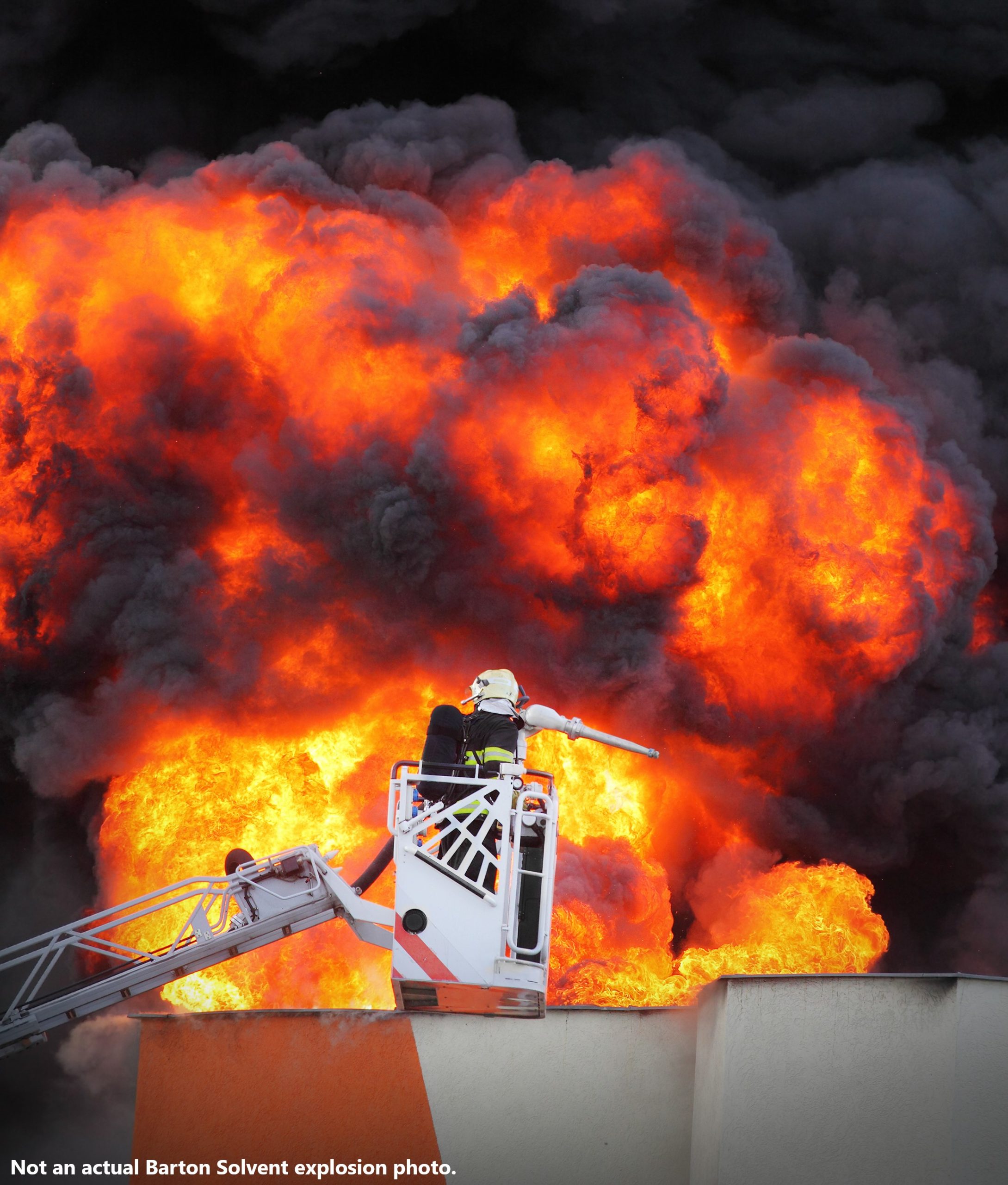 firefighter-in-crane-extinguishing-exploding-building