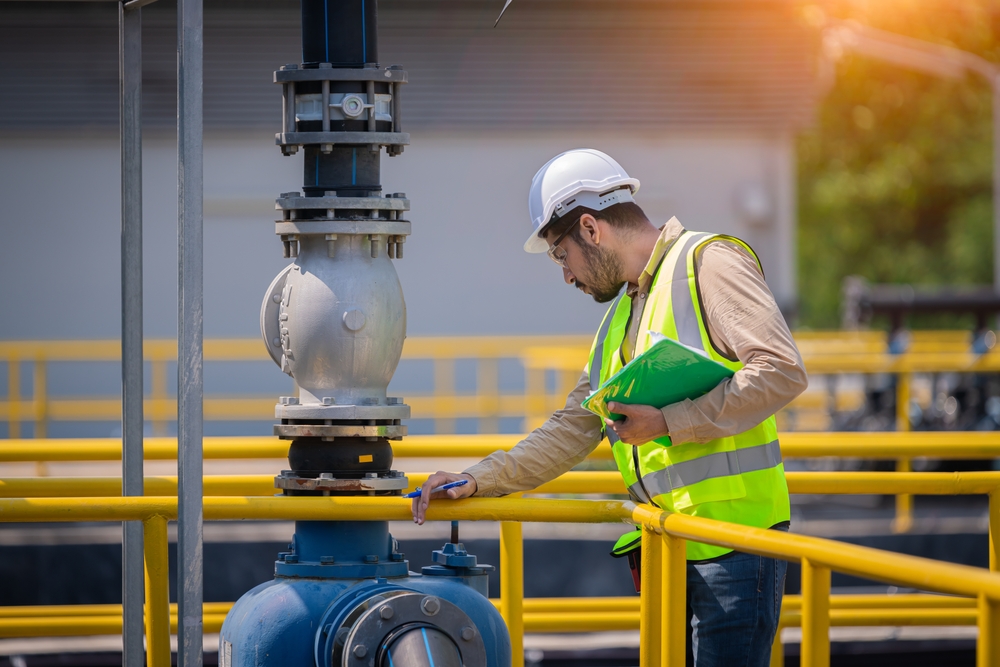 man-checking-pipes-for-issues