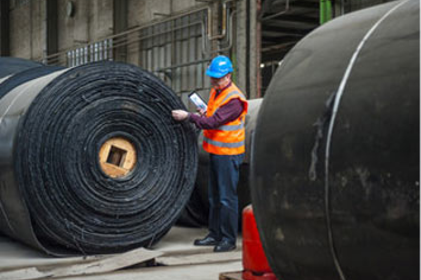 man-inspecting-plastic-production