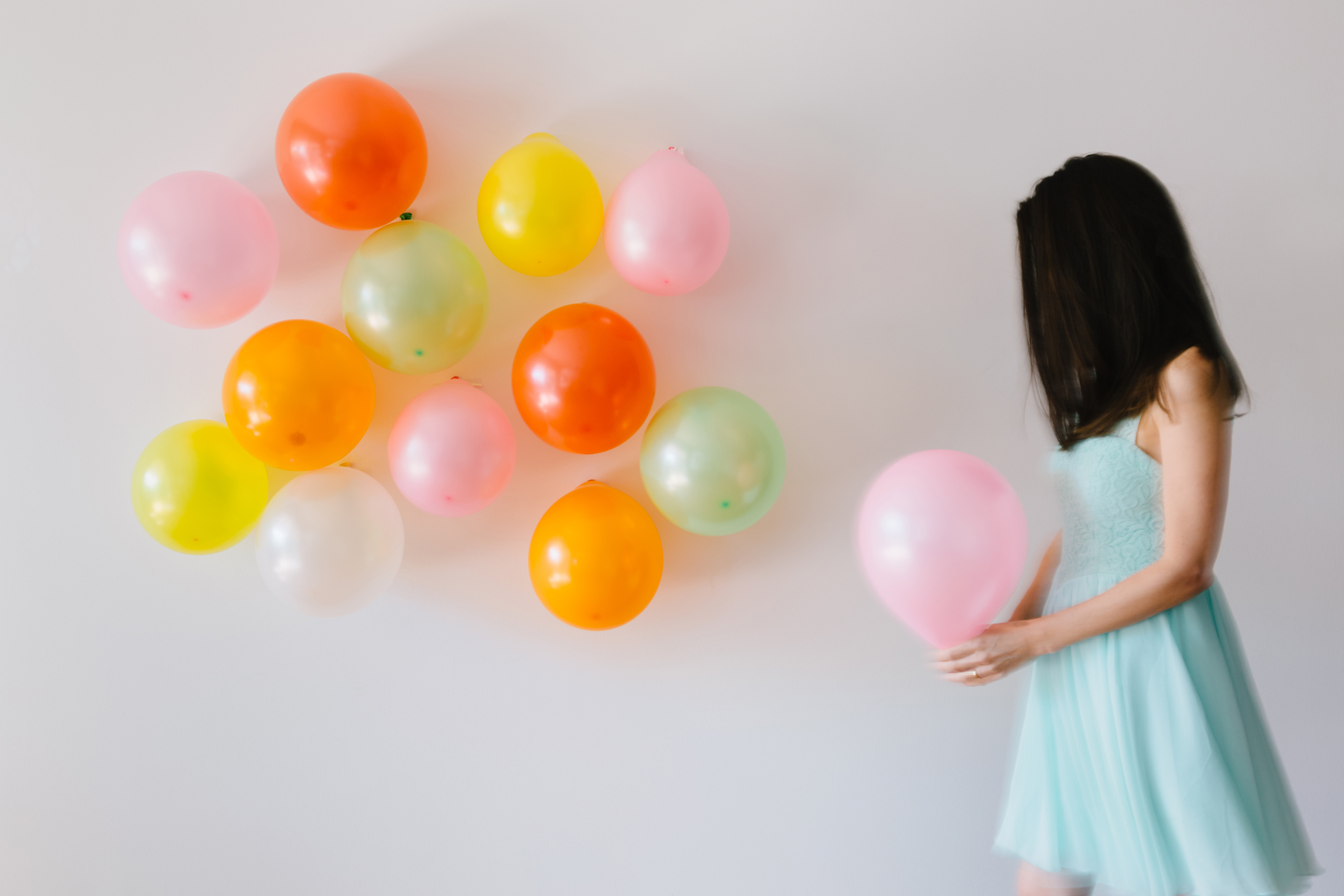 woman-holding-balloons