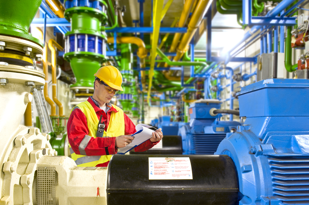 Engineer looking at a checklist during maintenance work